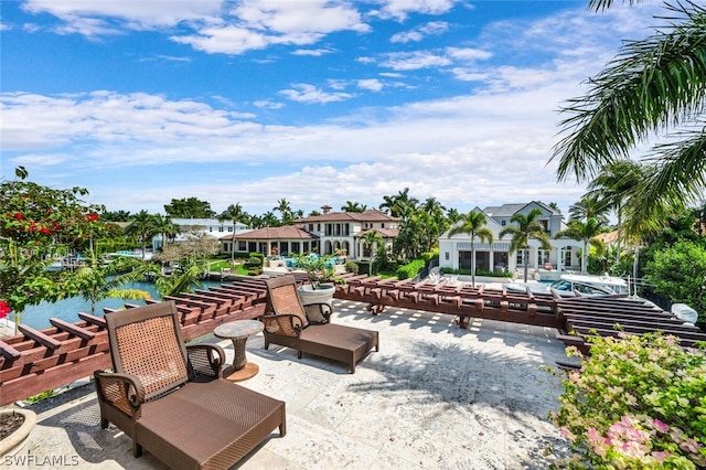 view of home's community featuring a water view and a patio area