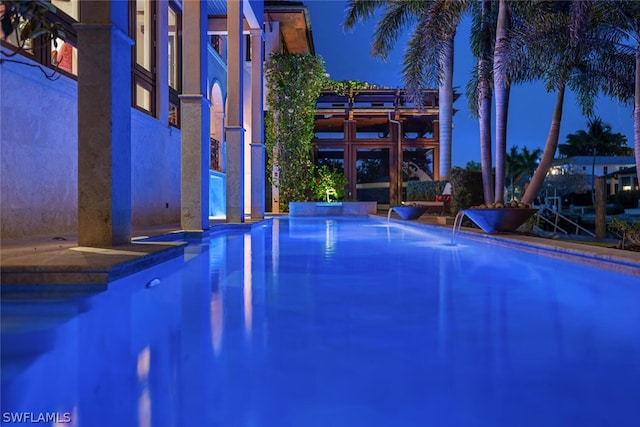 view of pool featuring pool water feature