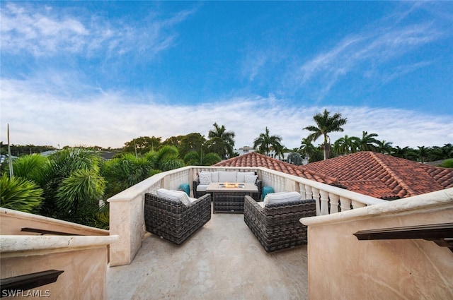 view of patio / terrace with an outdoor living space with a fire pit