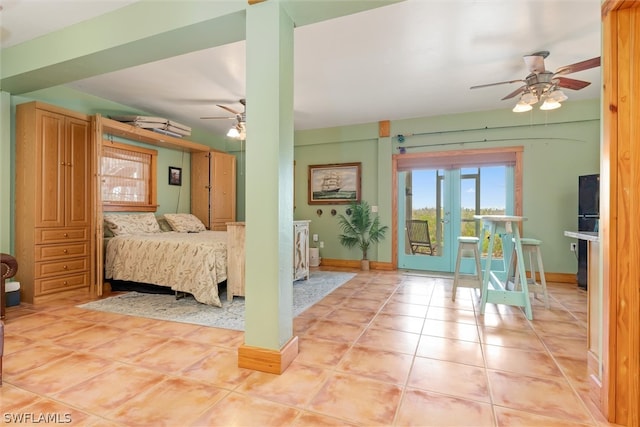 tiled bedroom featuring ceiling fan, access to outside, and french doors