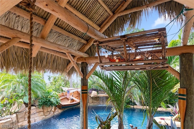 view of pool featuring a gazebo and pool water feature