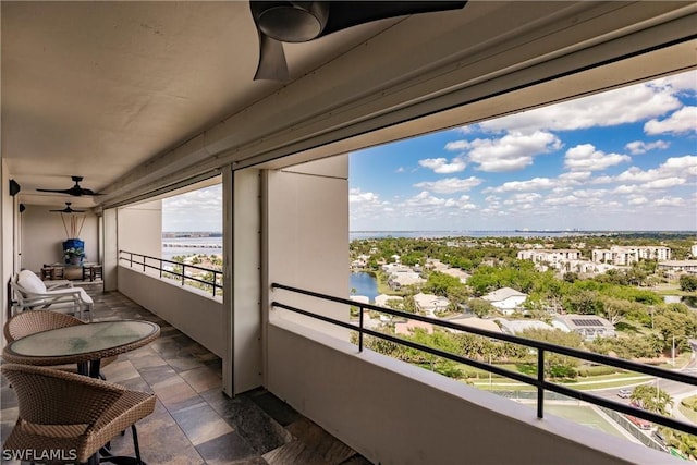 balcony featuring a water view