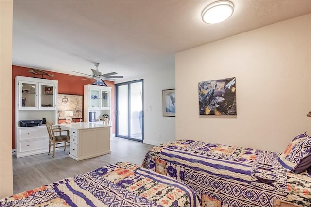 bedroom with light hardwood / wood-style flooring and ceiling fan