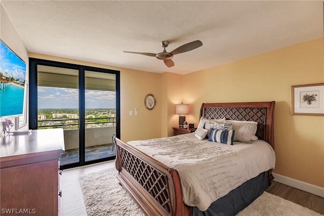 bedroom with ceiling fan, light hardwood / wood-style floors, and access to exterior