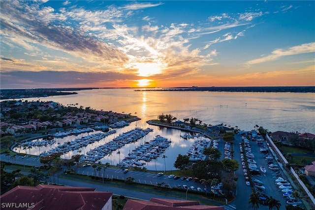 aerial view at dusk with a water view