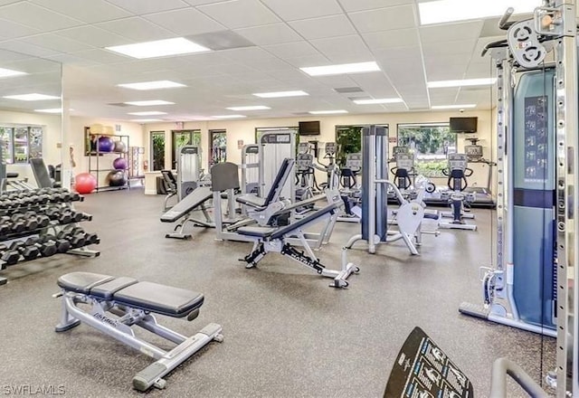 exercise room featuring a paneled ceiling