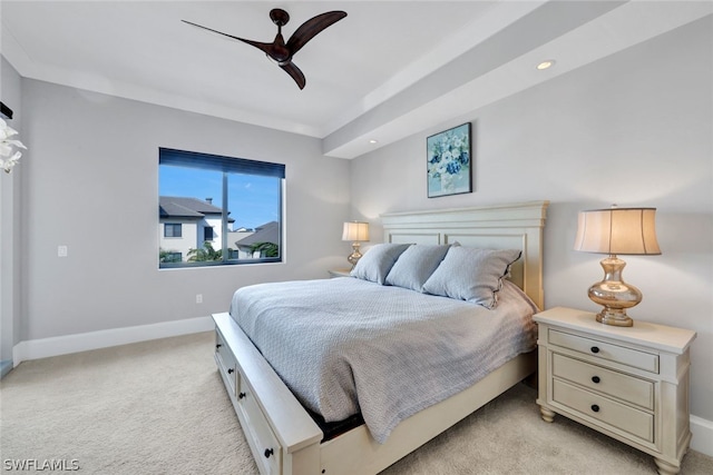 bedroom with ceiling fan and light colored carpet