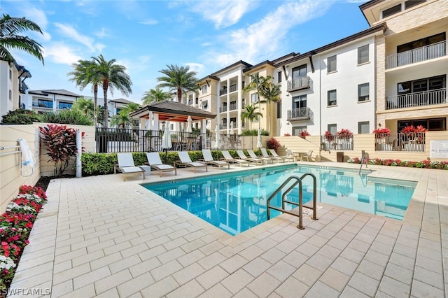 view of swimming pool featuring a patio area and a gazebo