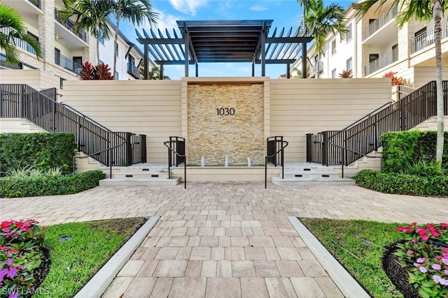 view of home's community featuring a pergola