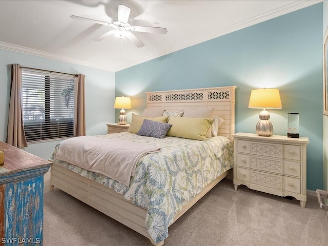 carpeted bedroom with ceiling fan and crown molding