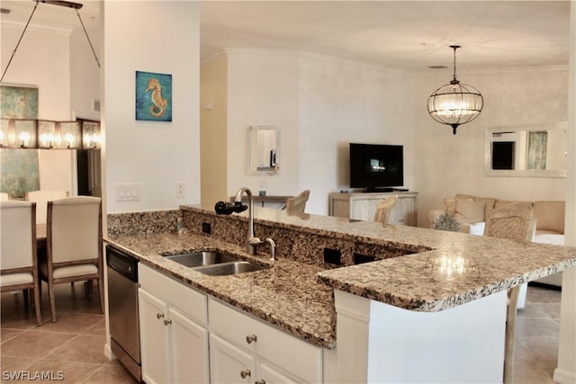 kitchen with light tile patterned floors, light stone countertops, white cabinetry, a sink, and dishwasher