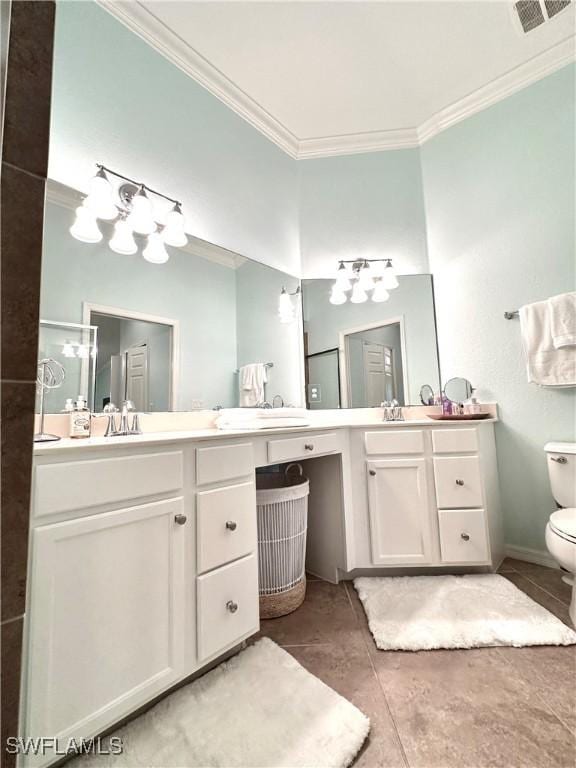 bathroom featuring vanity, visible vents, ornamental molding, tile patterned floors, and toilet