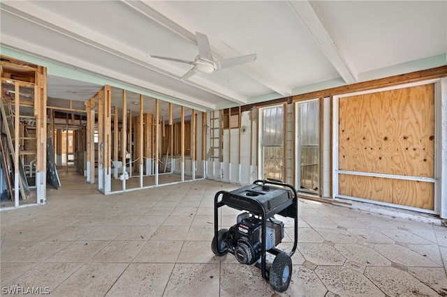 misc room with beam ceiling and ceiling fan