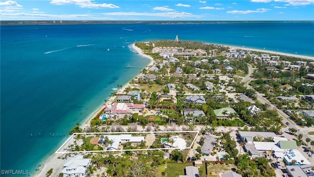 drone / aerial view featuring a view of the beach and a water view