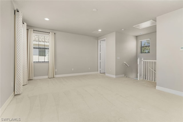 unfurnished room with light colored carpet