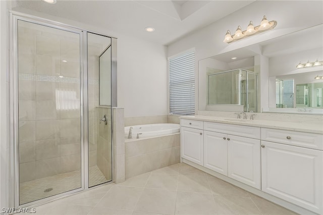 bathroom with vanity, plus walk in shower, tile floors, and plenty of natural light