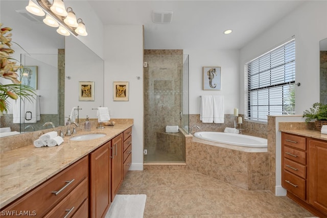 bathroom with vanity, tile patterned flooring, and shower with separate bathtub