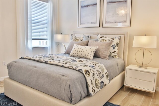 bedroom with light hardwood / wood-style floors