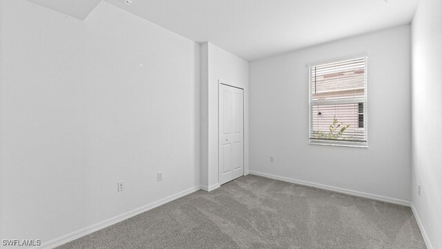 16556 Kingwood Ln Unit 34-101, Babcock Ranch, FL 33982 - empty room with light colored carpet