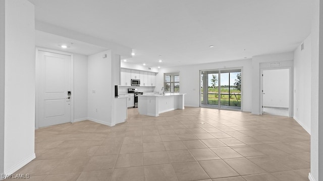 16556 Kingwood Ln Unit 34-101, Babcock Ranch, FL 33982 - unfurnished living room with light tile patterned floors