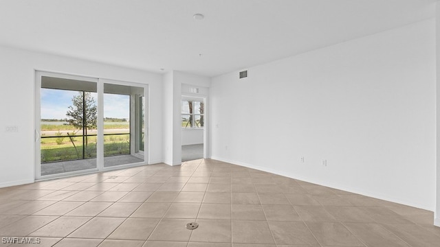 view of tiled spare room