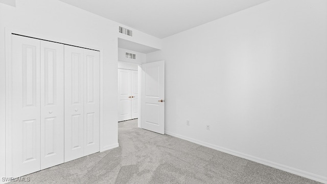 16556 Kingwood Ln Unit 34-101, Babcock Ranch, FL 33982 - unfurnished bedroom with light colored carpet and a closet