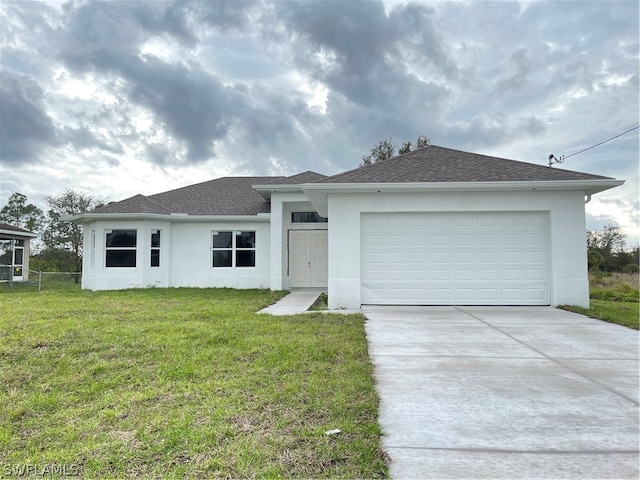 ranch-style house with a front lawn and a garage