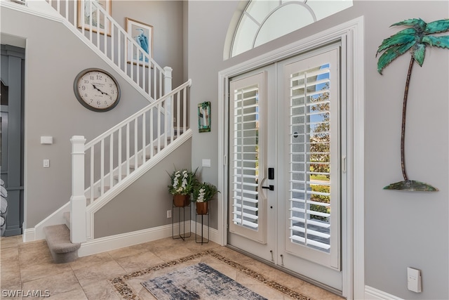 doorway with light tile flooring, french doors, and a wealth of natural light