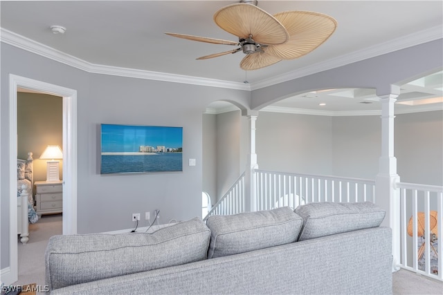 carpeted living room with coffered ceiling, ornate columns, crown molding, and ceiling fan