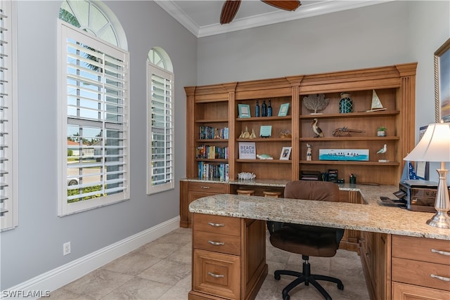 tiled office space with crown molding, ceiling fan, and built in desk