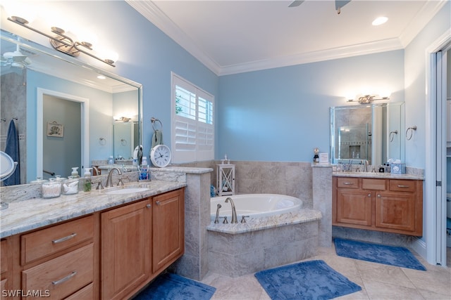 bathroom featuring ceiling fan, tile flooring, a relaxing tiled bath, crown molding, and dual bowl vanity