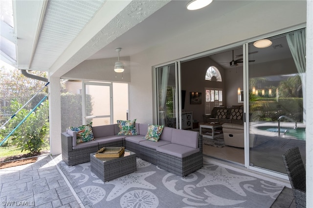 view of patio / terrace with an outdoor living space and ceiling fan