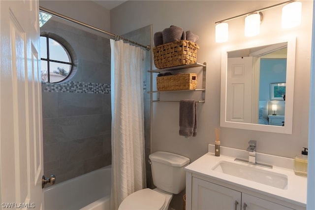 full bathroom with vanity, toilet, and shower / bath combination with curtain