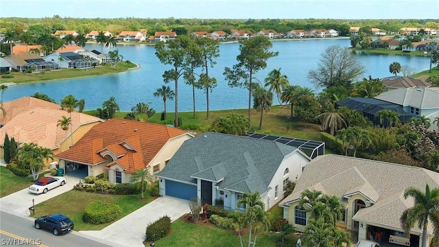 birds eye view of property with a water view