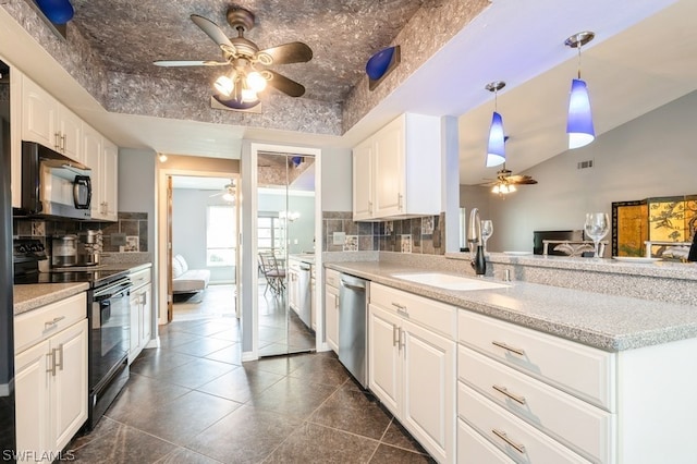 kitchen with white cabinets, sink, backsplash, and black appliances