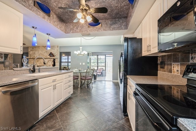 kitchen with black appliances, a raised ceiling, sink, hanging light fixtures, and white cabinetry