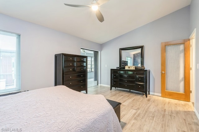 bedroom with french doors, ceiling fan, light hardwood / wood-style flooring, and lofted ceiling