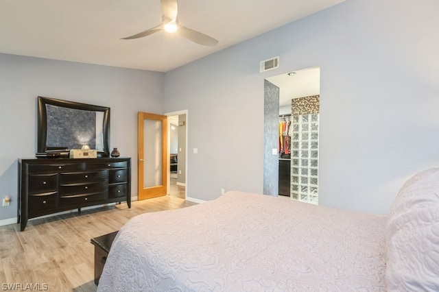 bedroom featuring hardwood / wood-style floors and ceiling fan