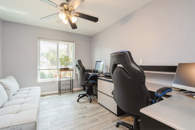 office area with light wood-type flooring and ceiling fan