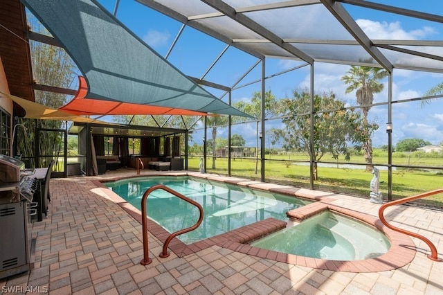 view of pool with glass enclosure, a patio area, and an in ground hot tub