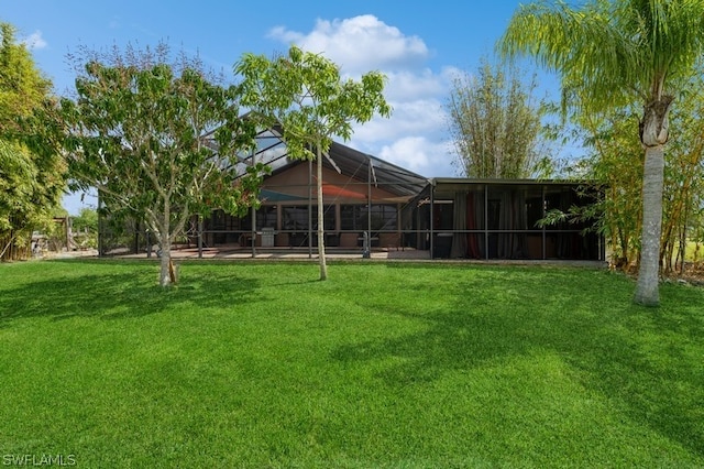 view of yard with a lanai