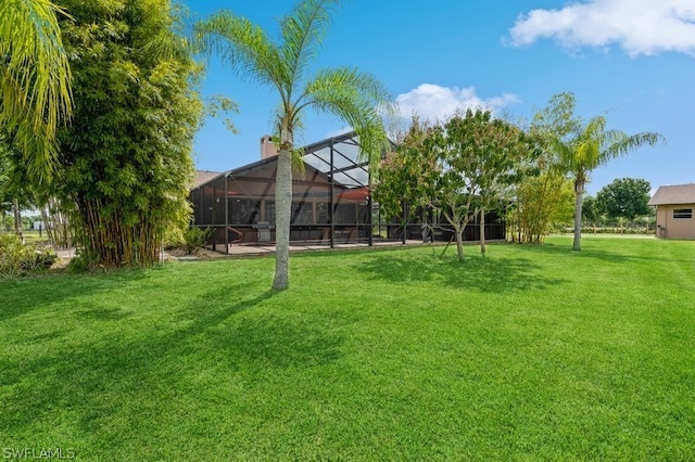 view of yard featuring a lanai