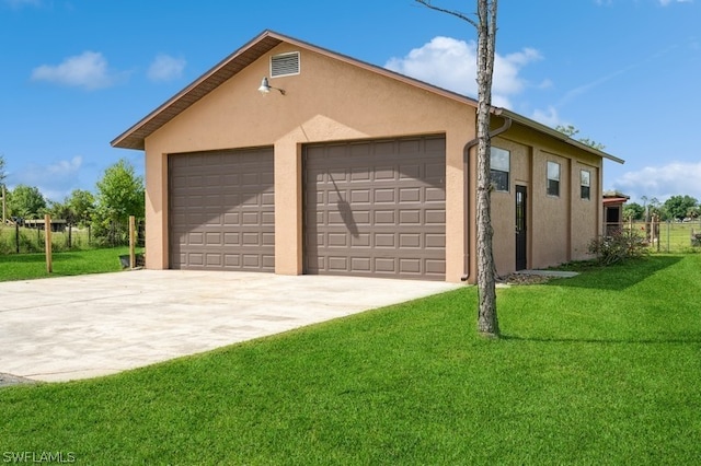 garage with a yard