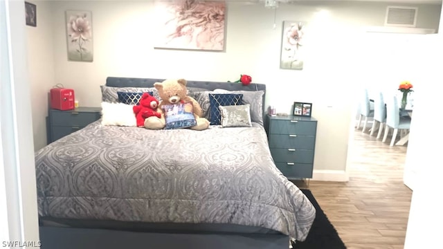 bedroom featuring light hardwood / wood-style floors