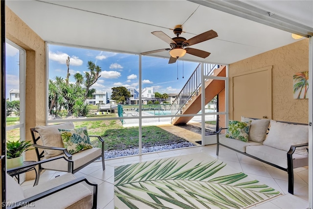 sunroom with ceiling fan