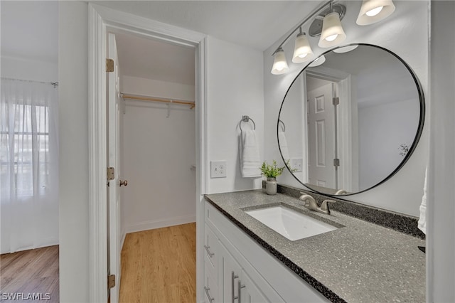 bathroom featuring vanity and wood-type flooring