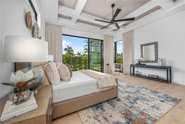 bedroom with access to outside, coffered ceiling, beamed ceiling, and light wood-style flooring