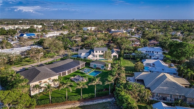 birds eye view of property with a residential view