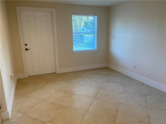 unfurnished bedroom featuring light tile flooring