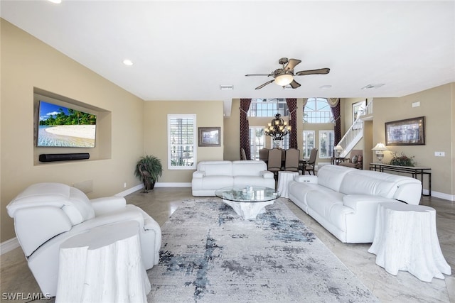 living room with a healthy amount of sunlight and ceiling fan